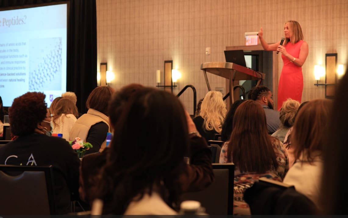 Clinical education session with a speaker and audience
